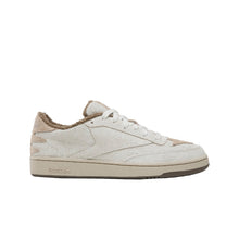 Load image into Gallery viewer, A single Reebok low-top sneaker in off-white suede and beige leather, shown from the side against a solid black background.