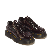 Load image into Gallery viewer, Black high-top sneakers with white soles on a light gray background